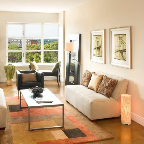 Generous living spaces to relax and unwind large picture windows in bright living room